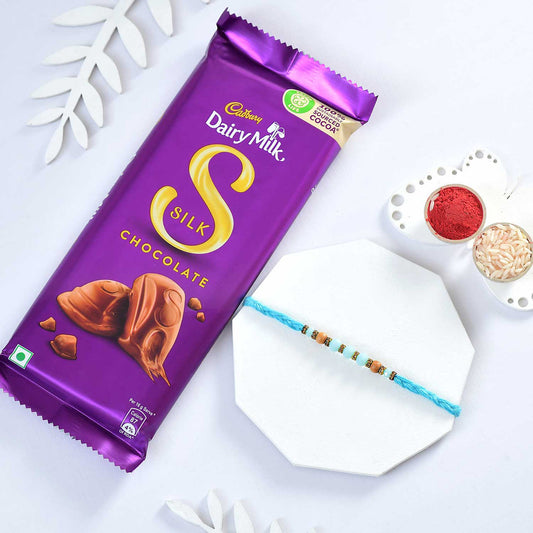 T4 Jewels Blue Colour Rakhi With Dairy Milk Silk (Gift)-SR2 Rakhi T4 Jewels